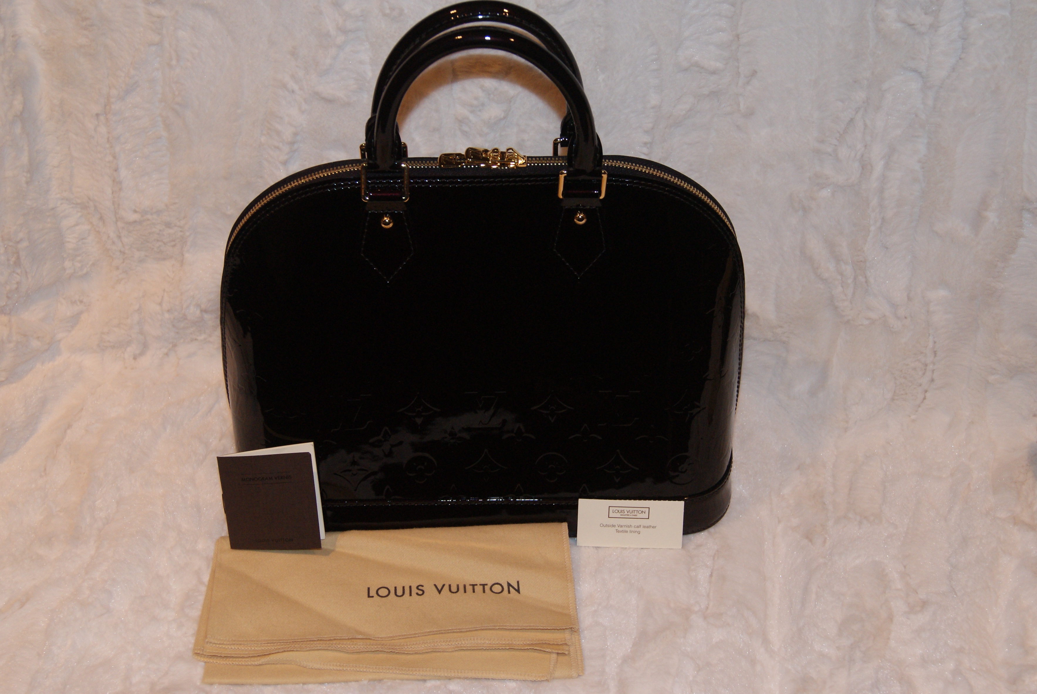 At Auction: Louis Vuitton, Louis Vuitton Amarante Monogram Vernis